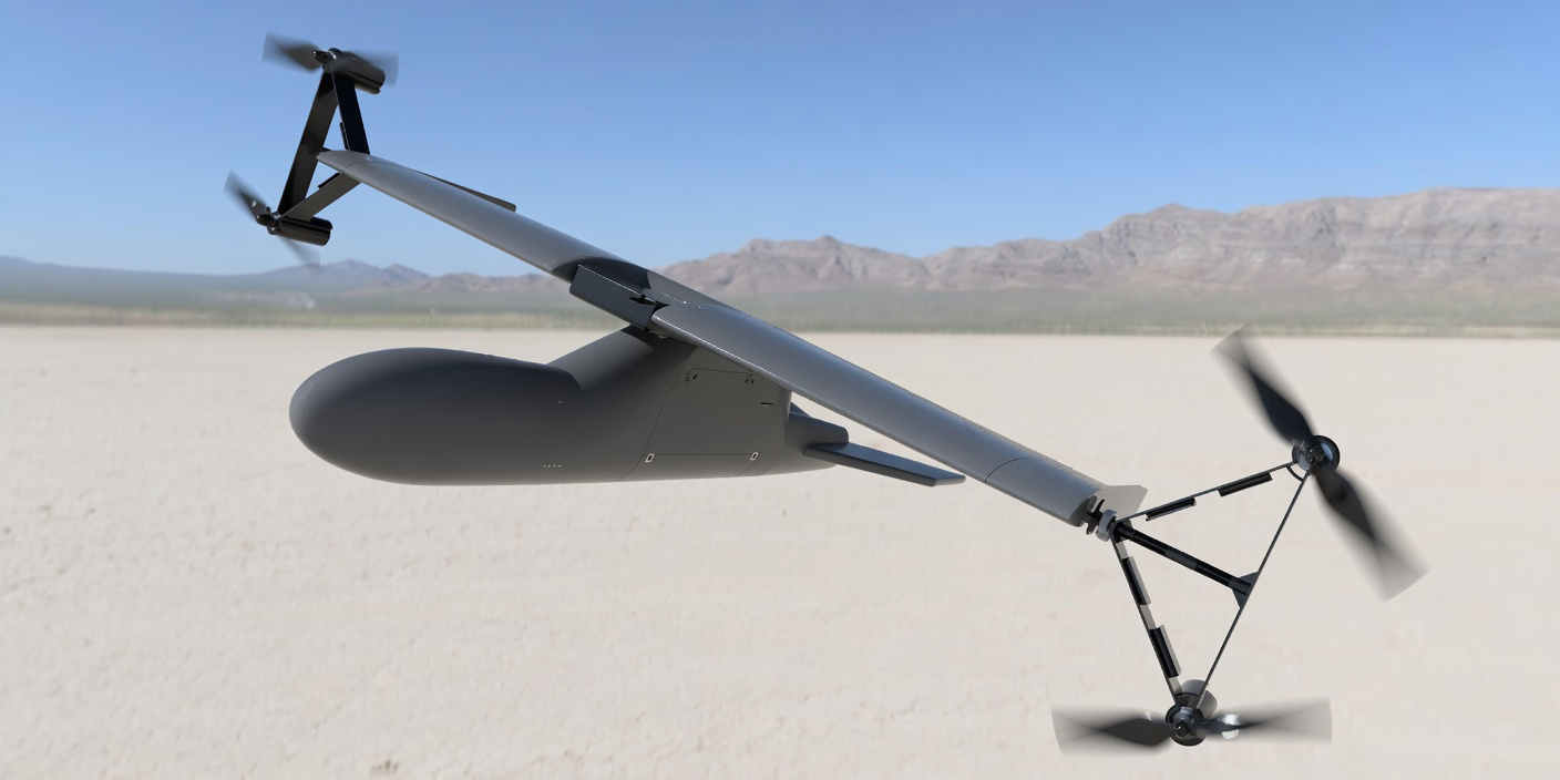 VTOL drone featuring PTERO technology flying across a dry lake bed.